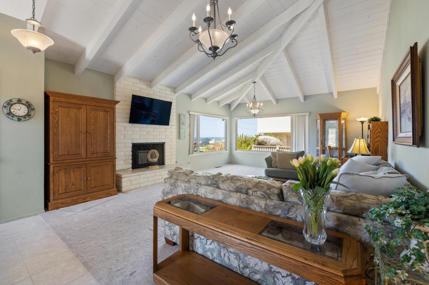 1244 Surf Avenue Pacific Grove, CA 93950 - Photo 8 of 43 a living room with furniture fireplace and flat screen tv