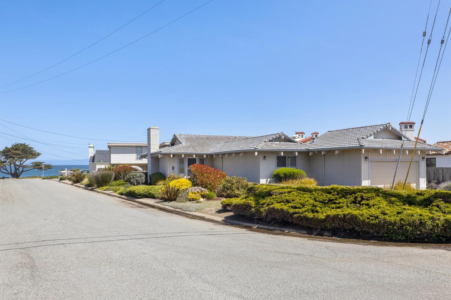 1244 Surf Avenue Pacific Grove, CA 93950 - Photo 10 of 43 a street view with tall buildings