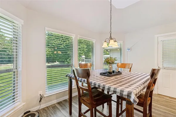 a view of a dining room with furniture window and outside view