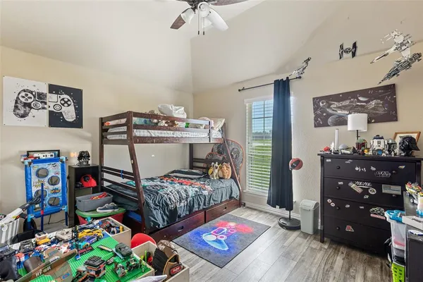 a bedroom with a bed and a tv in it