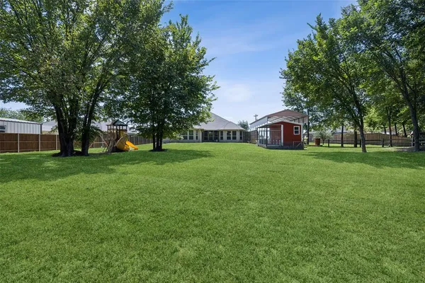 a view of a house with a big yard