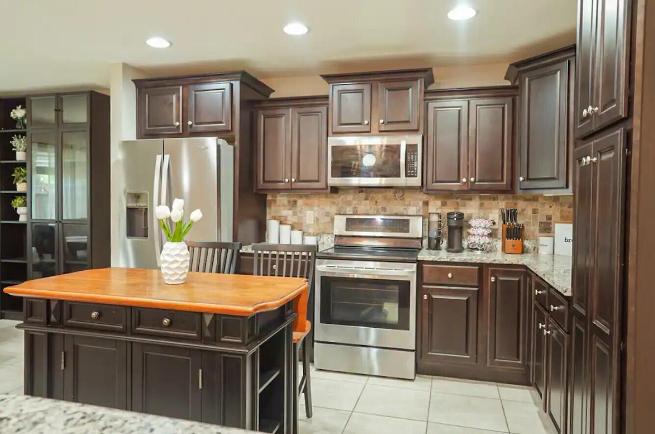 109 Thornhill Road Fort Walton Beach, FL 32547 - Photo 11 of 38 a kitchen with a stove sink and cabinets