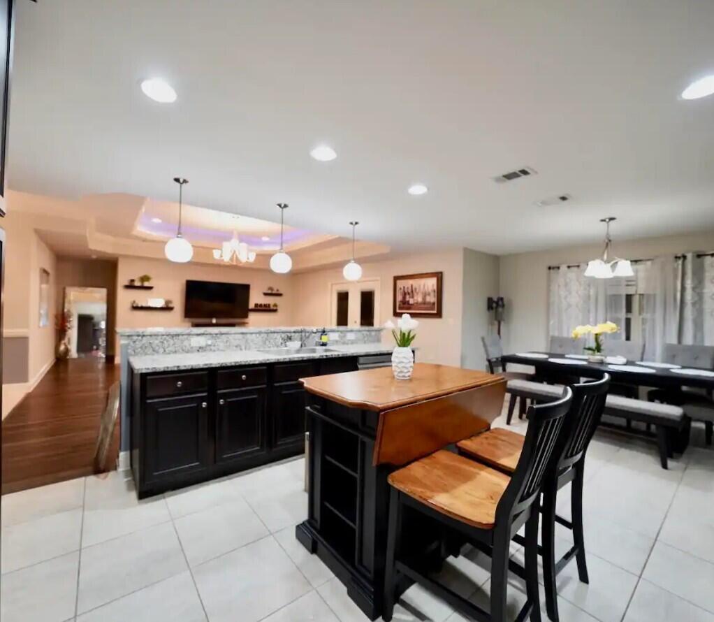 109 Thornhill Road Fort Walton Beach, FL 32547 - Photo 13 of 38 a kitchen with stainless steel appliances kitchen island granite countertop a sink and cabinets