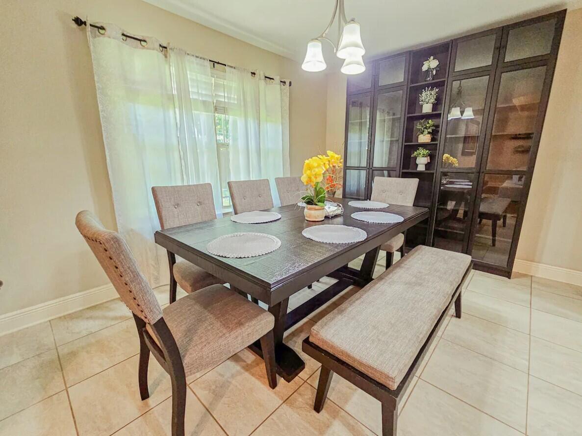 109 Thornhill Road Fort Walton Beach, FL 32547 - Photo 15 of 38 a view of a dining room with furniture and a chandelier