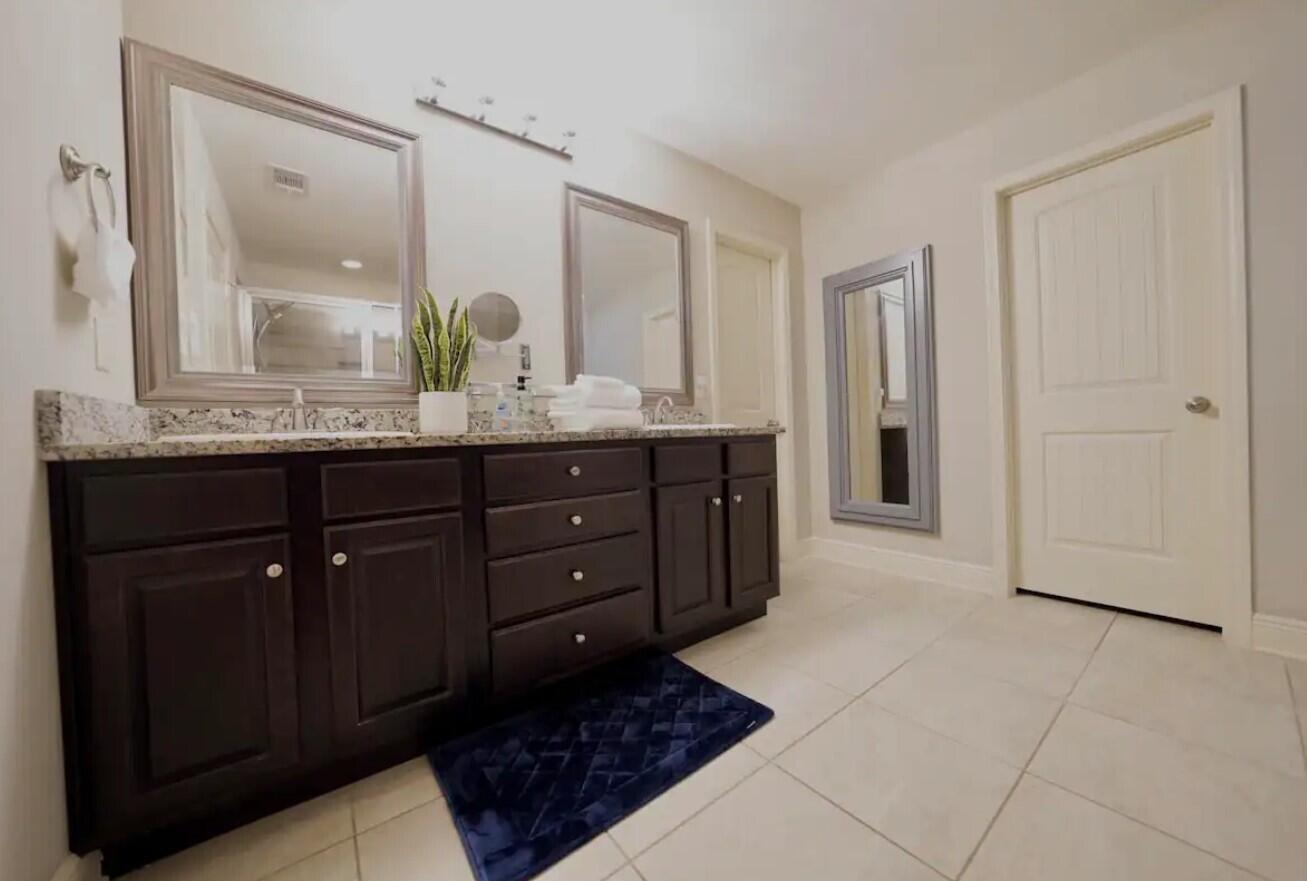 109 Thornhill Road Fort Walton Beach, FL 32547 - Photo 21 of 38 a bathroom with a granite countertop sink a mirror and a shower