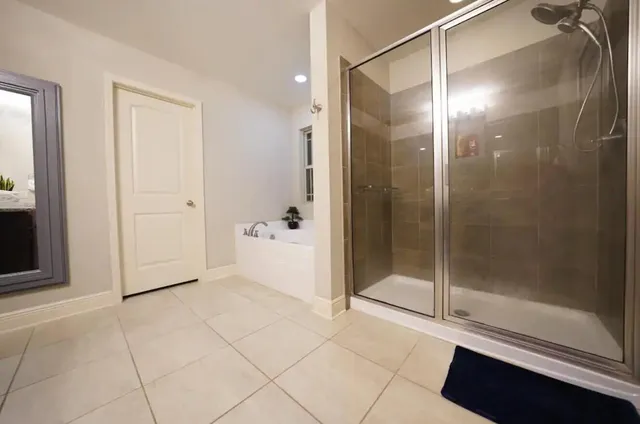 a bathroom with a shower and a sink