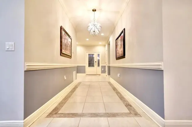 a view of a hallway with granite countertop a couch