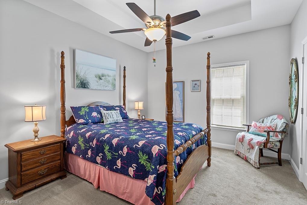 2018 Springwood Road Asheboro, NC 27205 - Photo 12 of 29 Primary Bedroom with walk-in closet and tray ceiling with en suite.