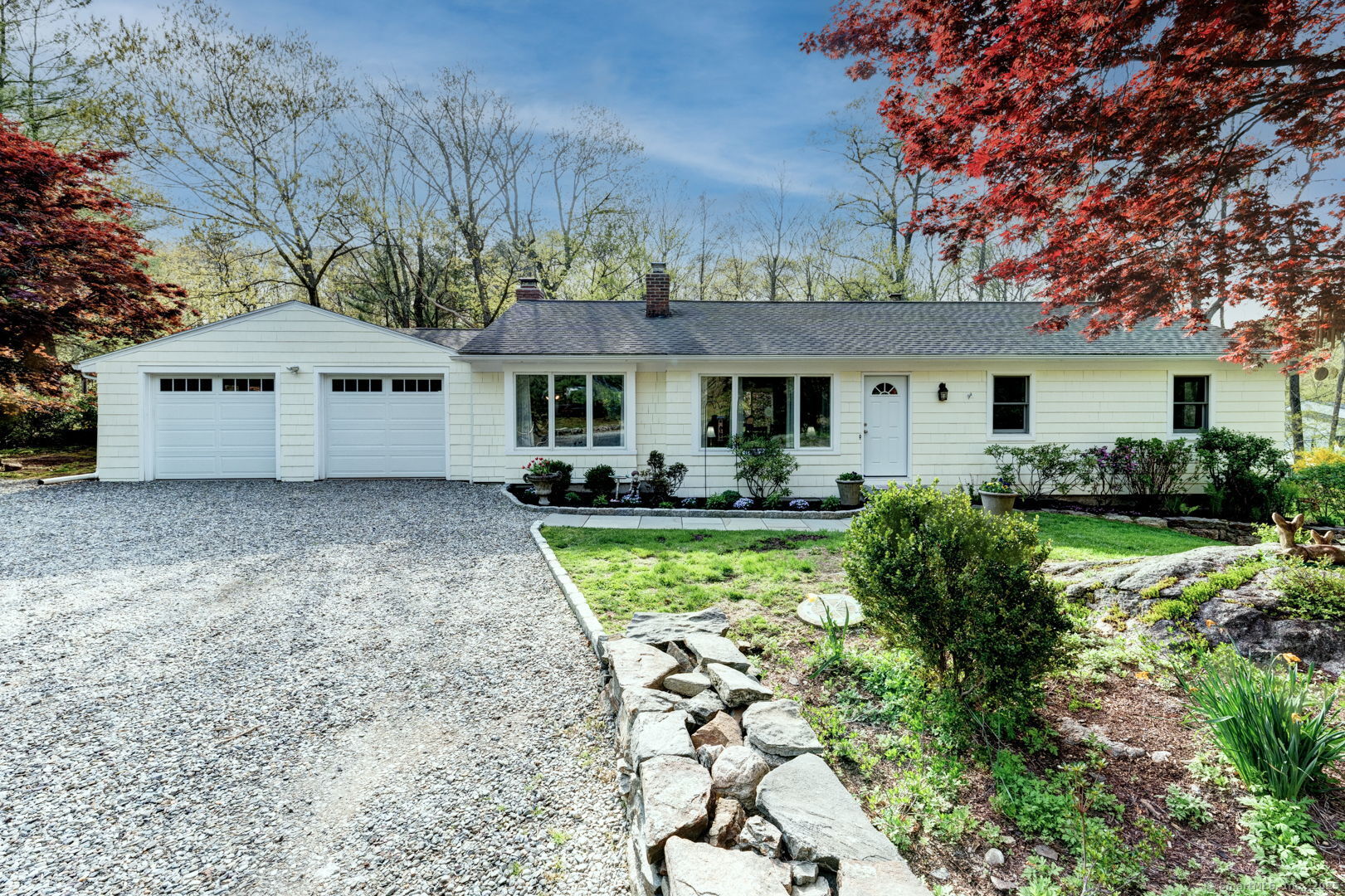 a front view of a house with garden