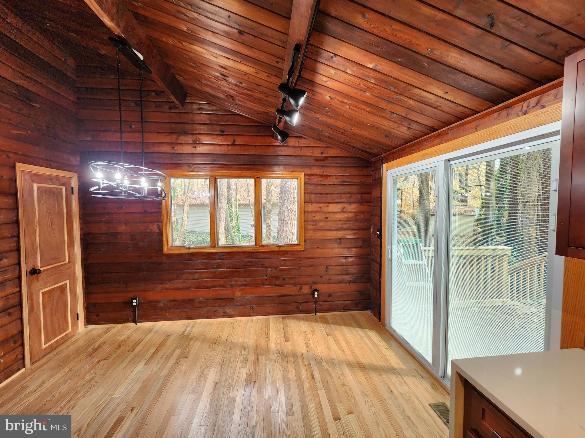 11577 Tomahawk Trail Lusby, MD 20657 - Photo 1 of 28 a view of an empty room with wooden floor and a window