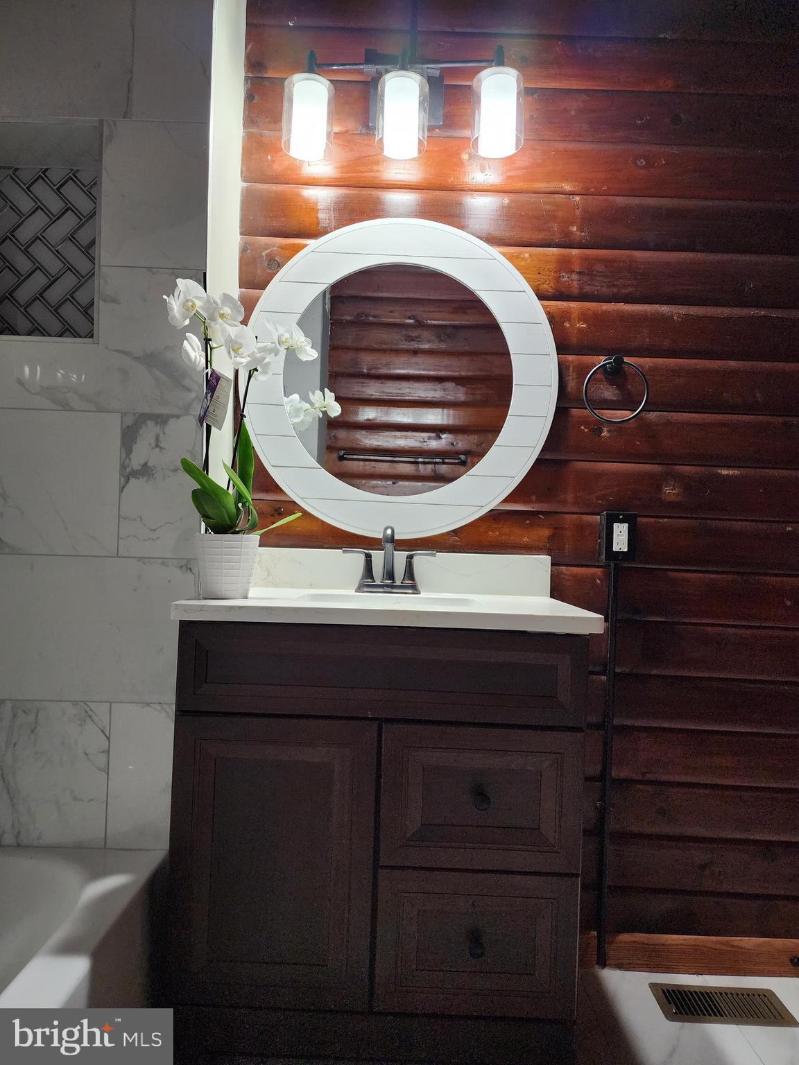 11577 Tomahawk Trail Lusby, MD 20657 - Photo 12 of 28 a bathroom with a sink and a mirror