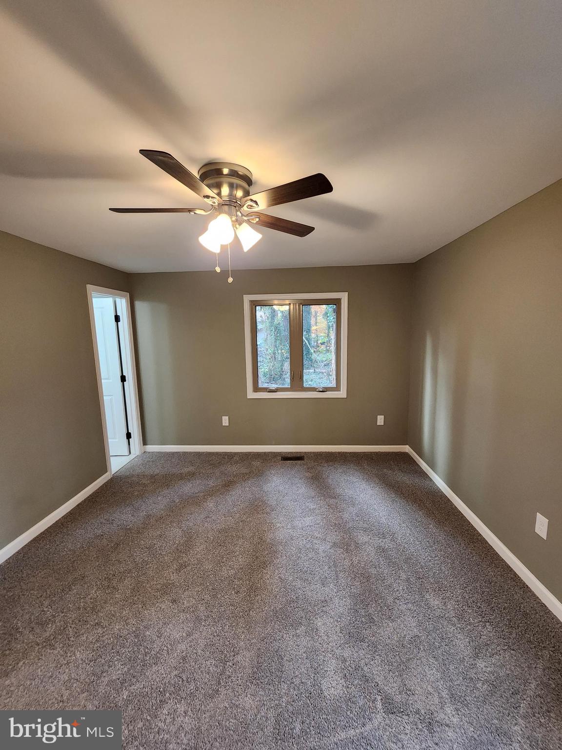 11577 Tomahawk Trail Lusby, MD 20657 - Photo 15 of 28 a view of an empty room with a window