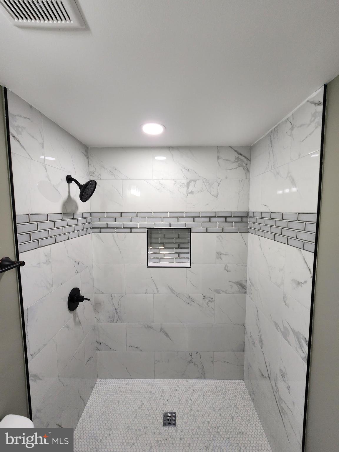 11577 Tomahawk Trail Lusby, MD 20657 - Photo 17 of 28 a bathroom with a shower