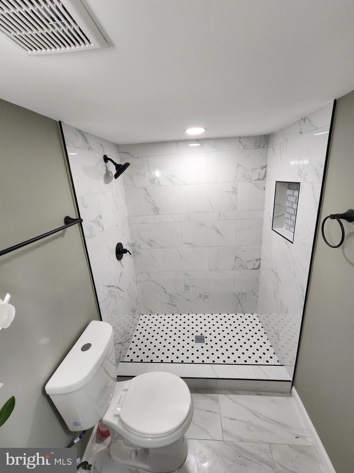 11577 Tomahawk Trail Lusby, MD 20657 - Photo 20 of 28 a bathroom with a toilet and a shower