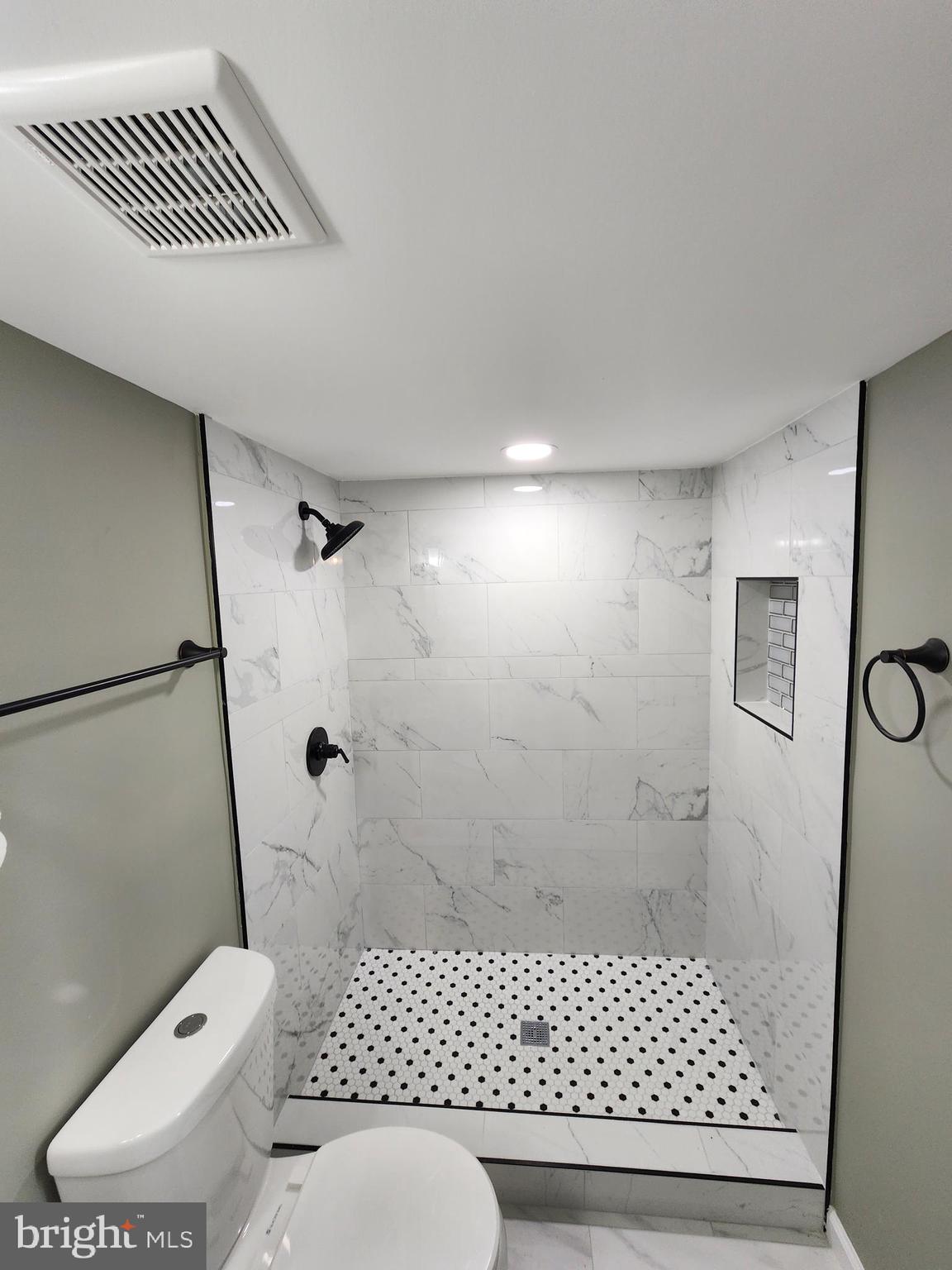 11577 Tomahawk Trail Lusby, MD 20657 - Photo 21 of 28 a bathroom with a toilet and a shower