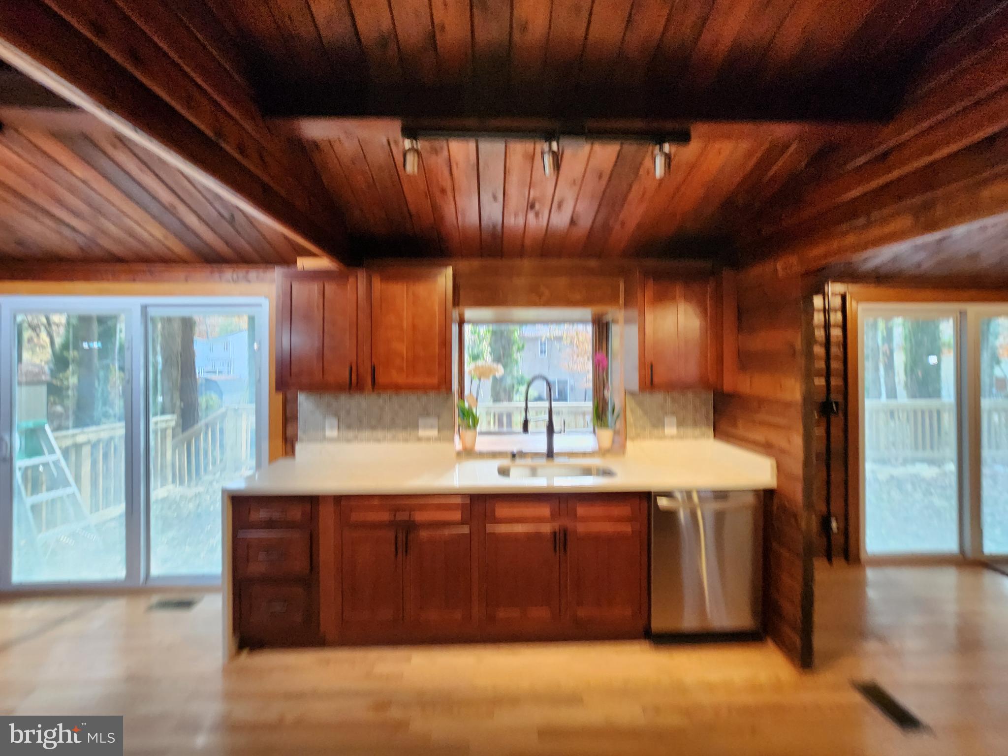 11577 Tomahawk Trail Lusby, MD 20657 - Photo 7 of 28 a kitchen with a sink and a refrigerator