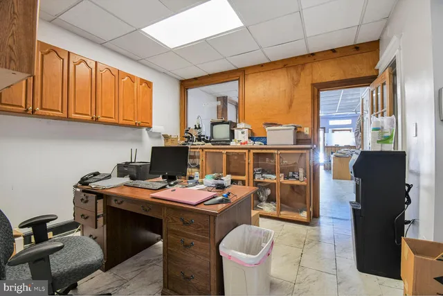 a work place with a large window and table