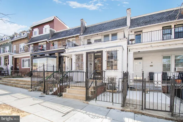 a view of a brick building with many windows