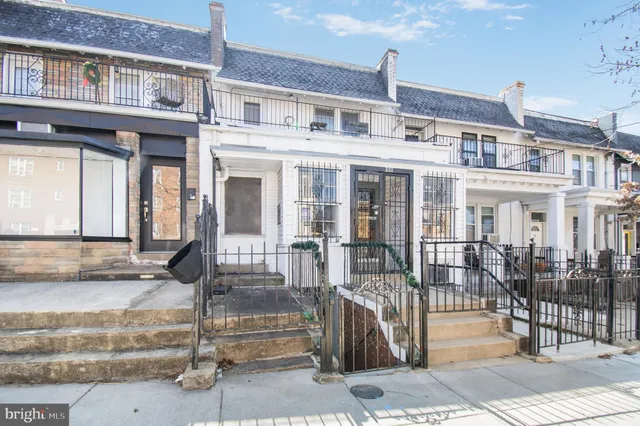 a front view of a building with glass windows