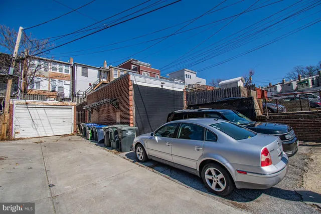 a view of a car in front of a house