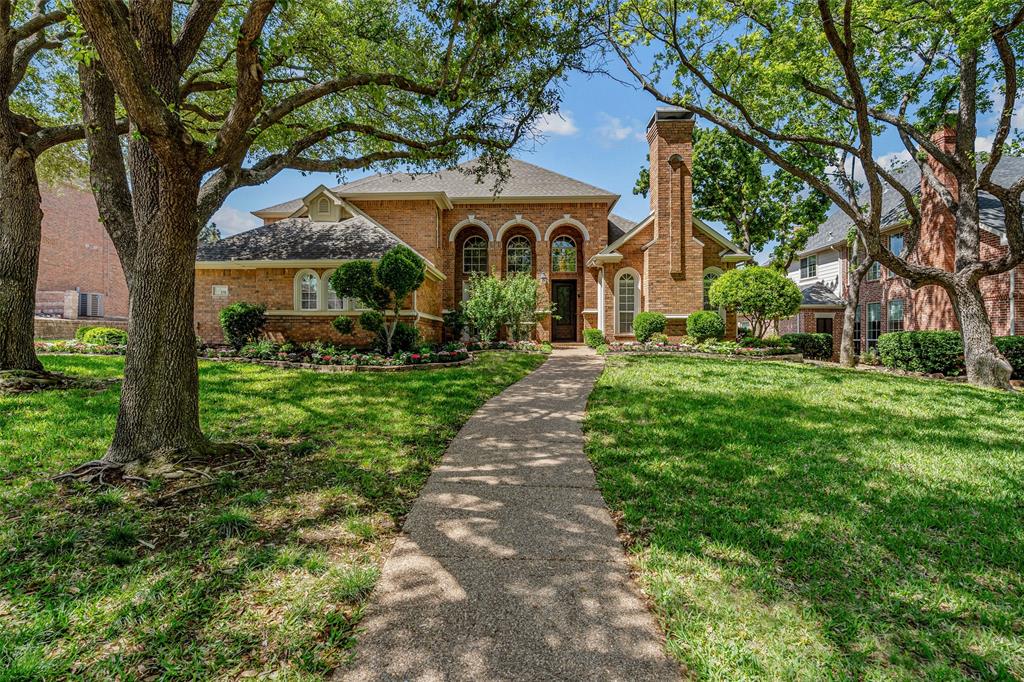 219 Ridgeview Lane Trophy Club, TX 76262 - Photo 1 of 1 View of front of home with a chimney, brick siding, and a front yard