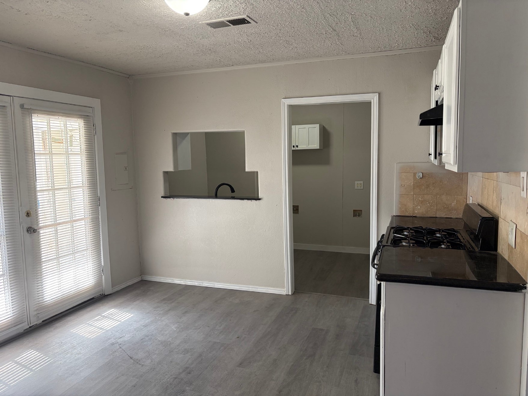 5406 Lyndhurst Drive Houston, TX 77033 - Photo 4 of 17 a kitchen with a stove and a refrigerator