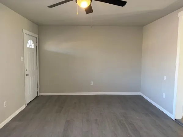 an empty room with a empty space and window