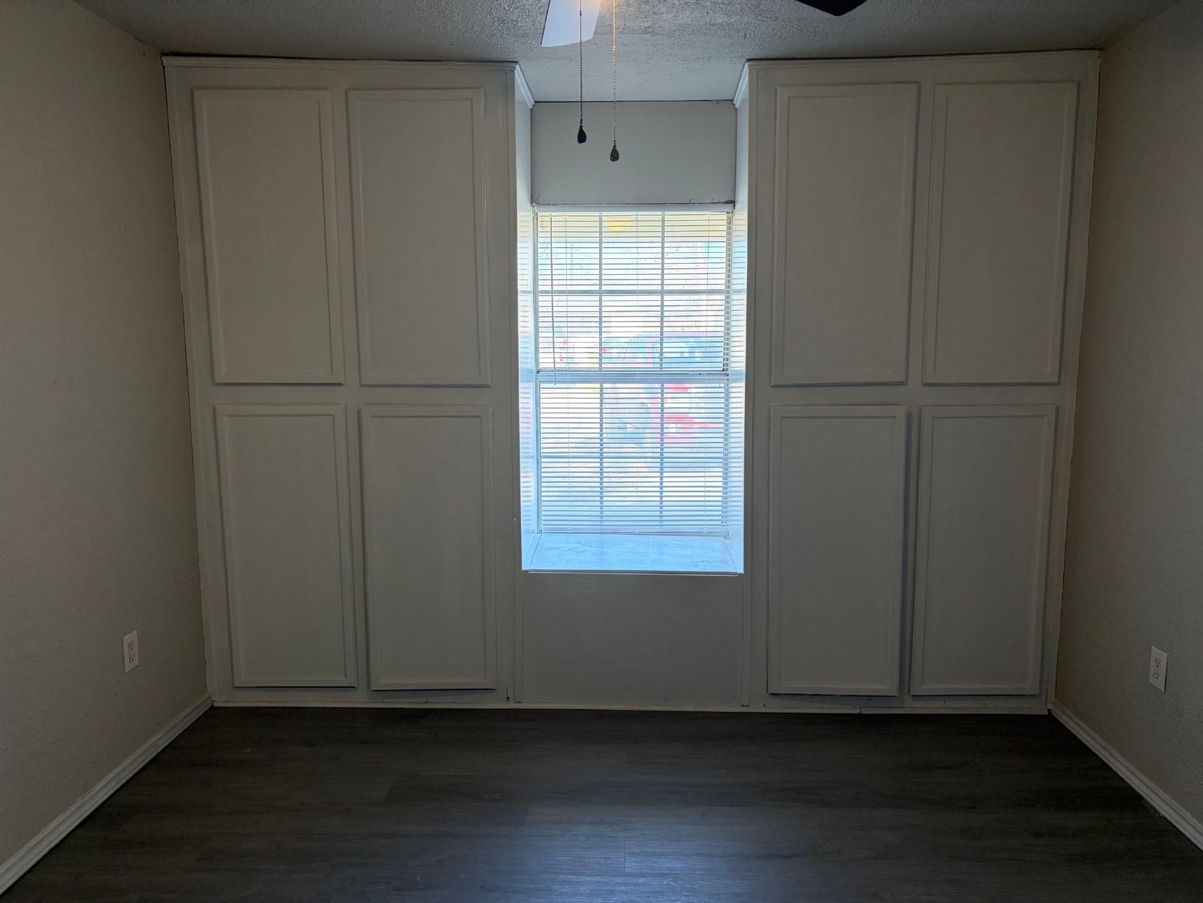 5406 Lyndhurst Drive Houston, TX 77033 - Photo 10 of 17 a view of an empty room with wooden floor and a window
