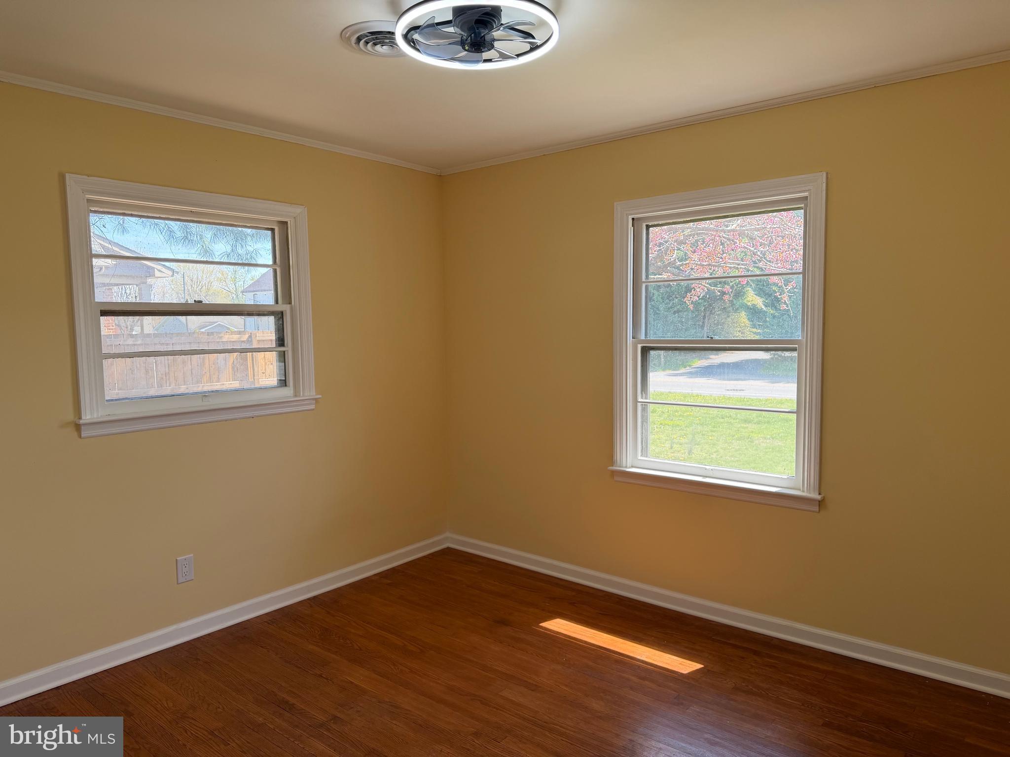 19124 Longmeadow Road Hagerstown, MD 21742 - Photo 16 of 23 a view of an empty room with wooden floor and a window