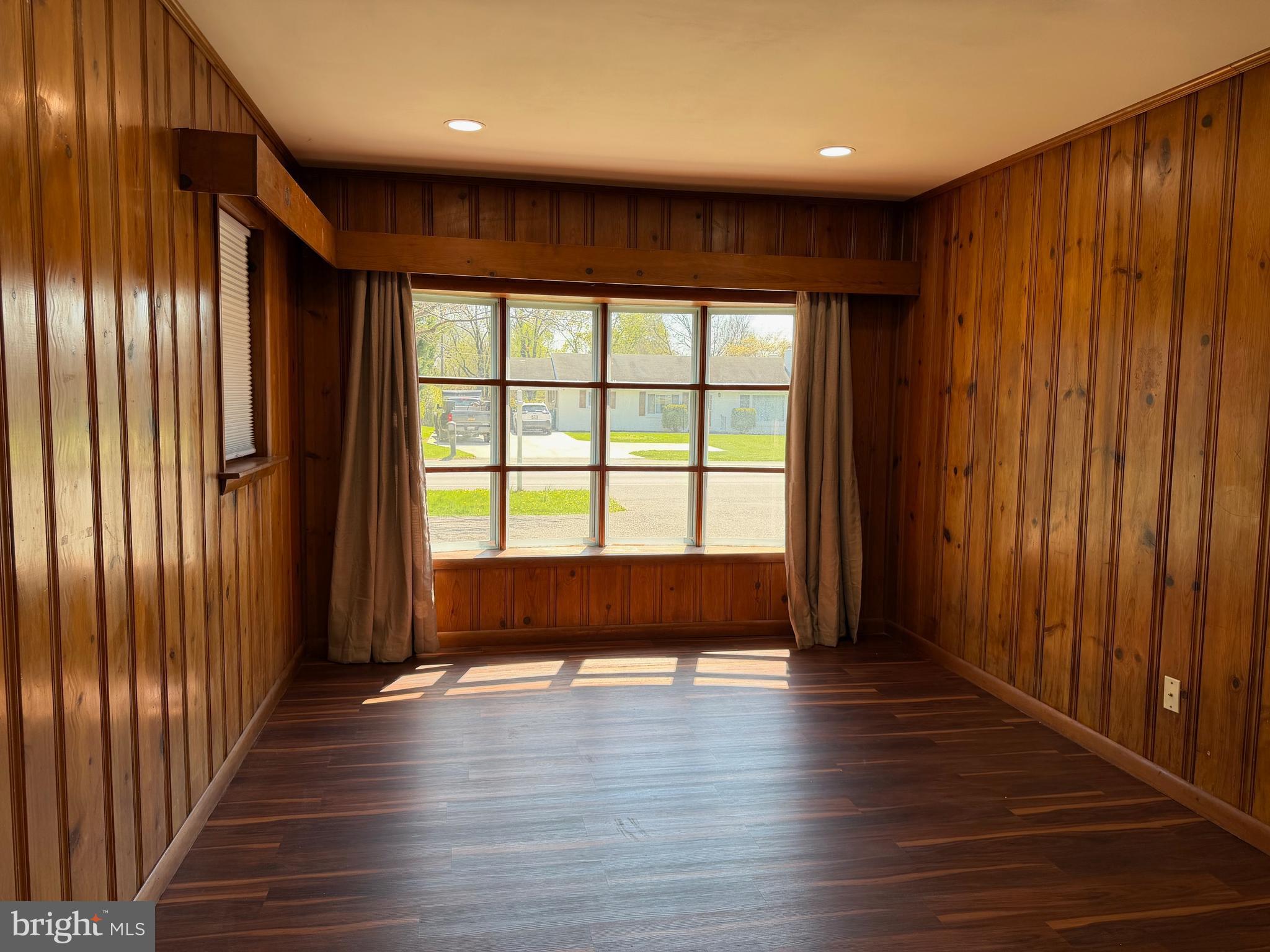 19124 Longmeadow Road Hagerstown, MD 21742 - Photo 20 of 23 an empty room with wooden floor and windows