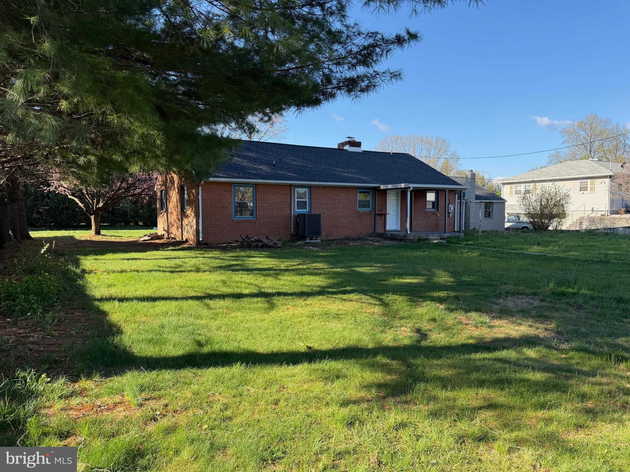 19124 Longmeadow Road Hagerstown, MD 21742 - Photo 4 of 23 a view of a big house with a big yard and large trees