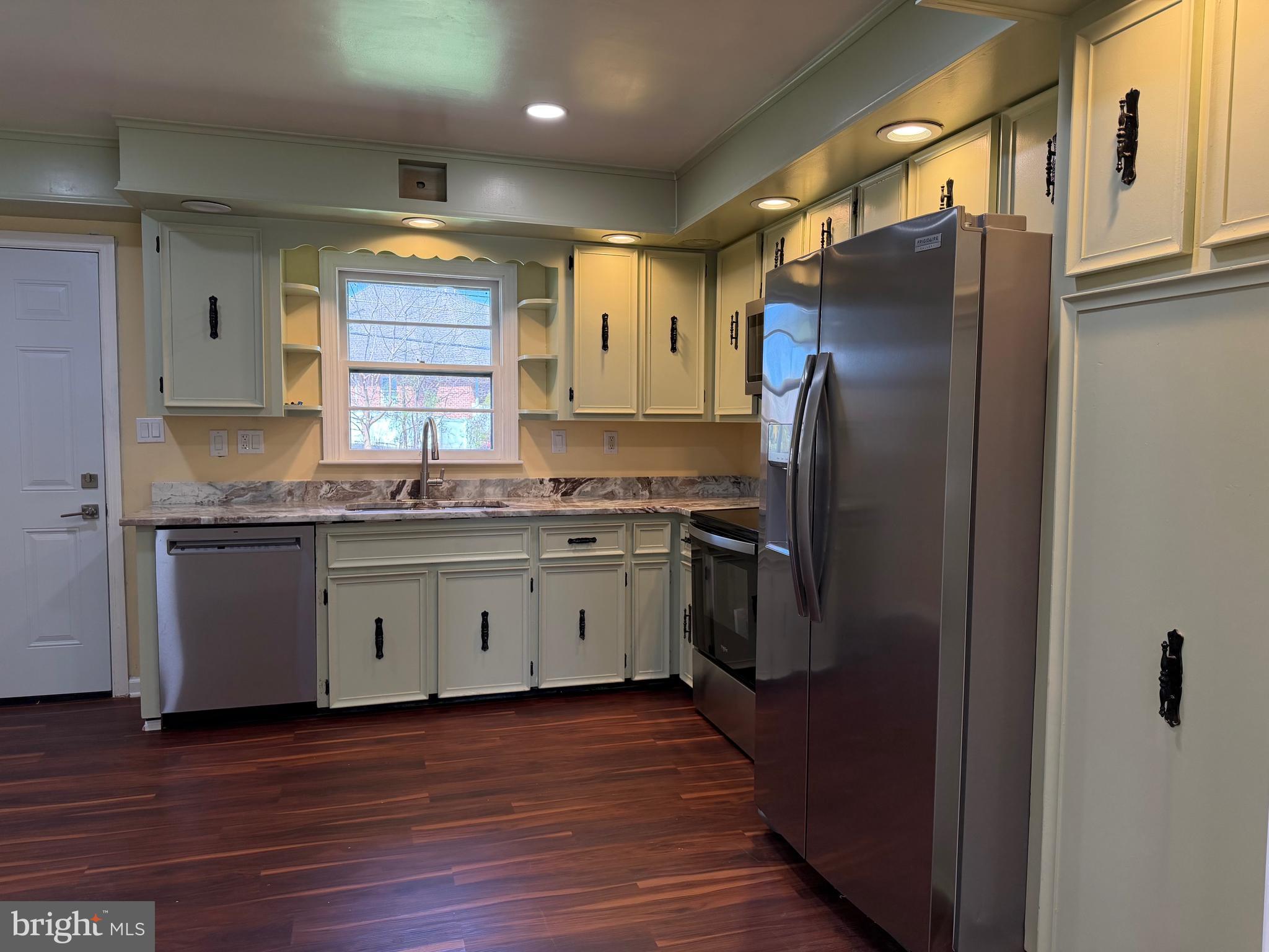 19124 Longmeadow Road Hagerstown, MD 21742 - Photo 8 of 23 a kitchen with granite countertop a refrigerator and a sink