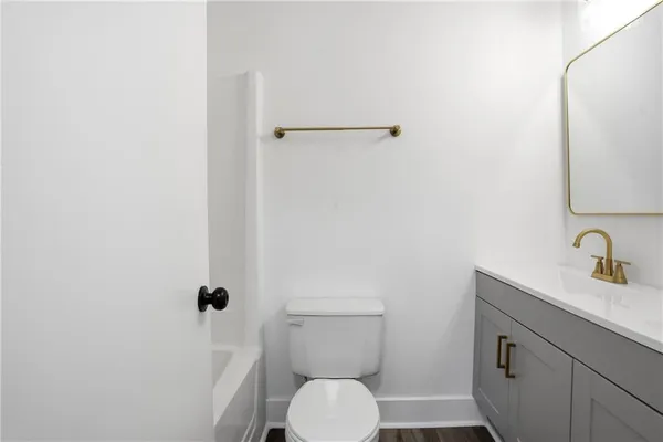 a bathroom with a toilet and a sink