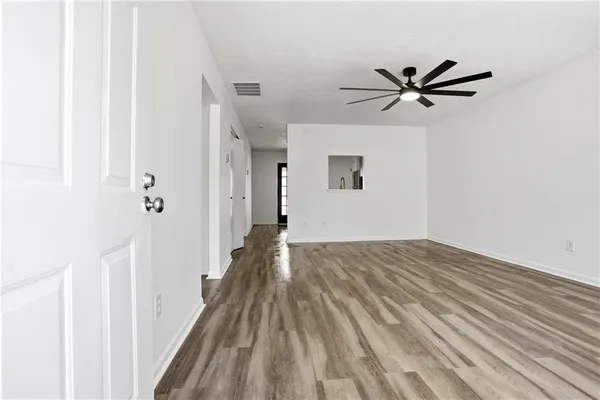 a view of a livingroom with wooden floor