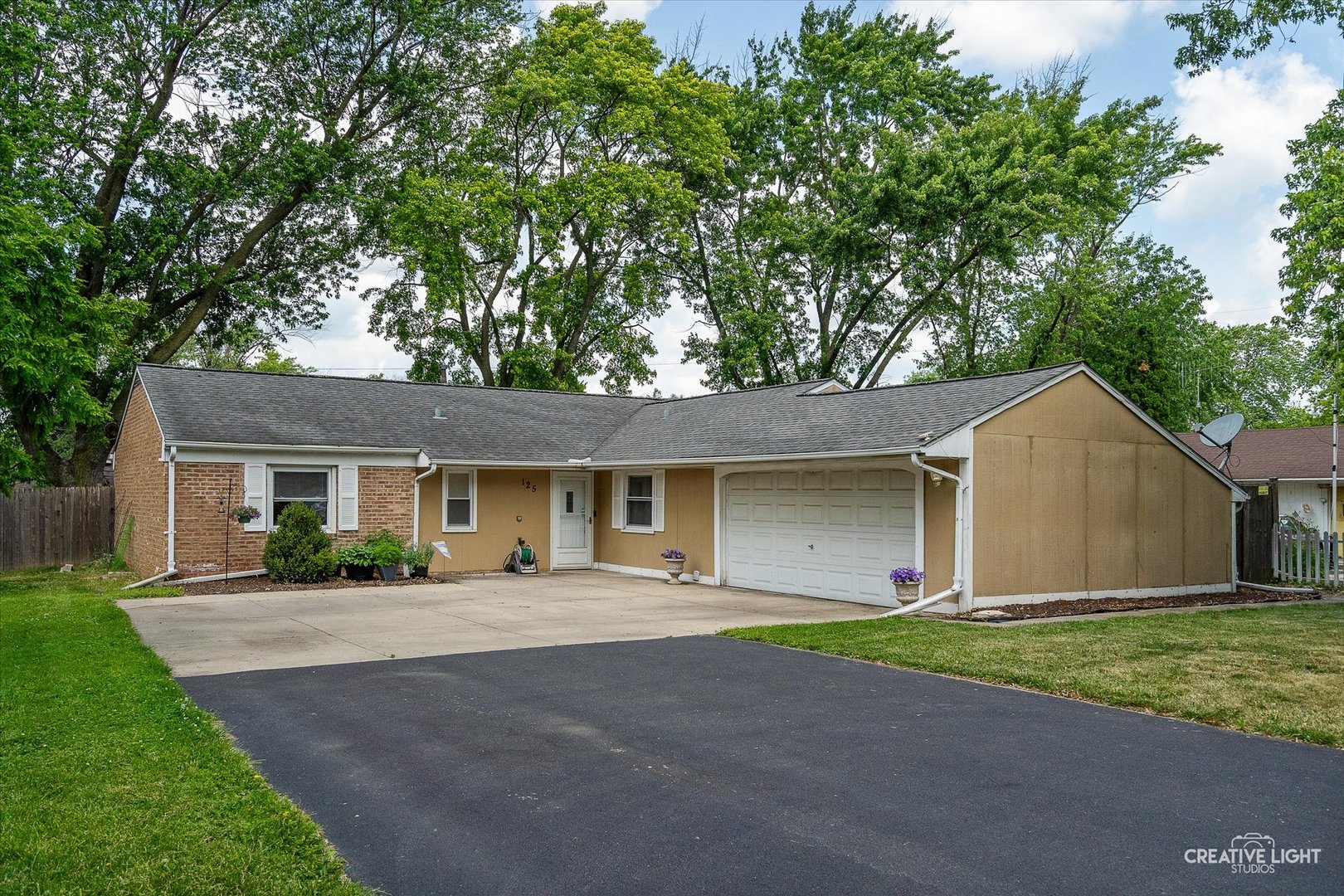 125 South Pinecrest Road Bolingbrook, IL 60440 - Photo 1 of 22 front view of house with a yard