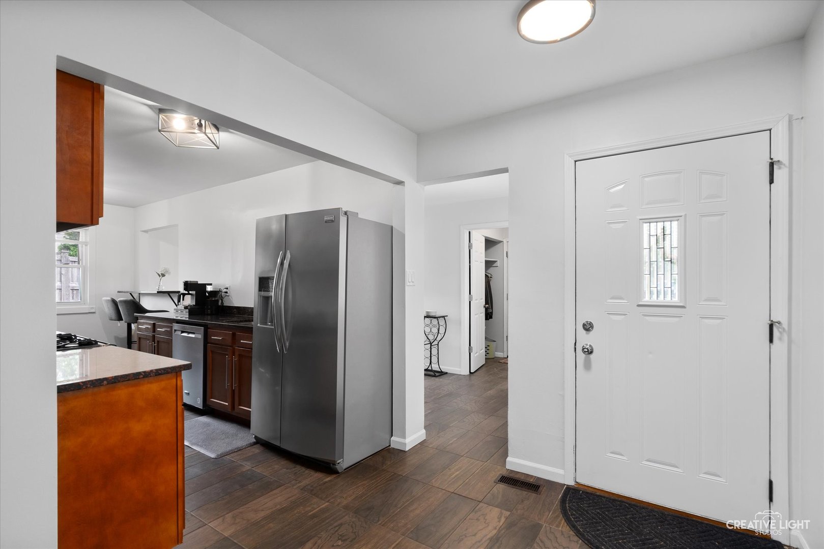 125 South Pinecrest Road Bolingbrook, IL 60440 - Photo 13 of 22 a kitchen with stainless steel appliances granite countertop a refrigerator and a stove