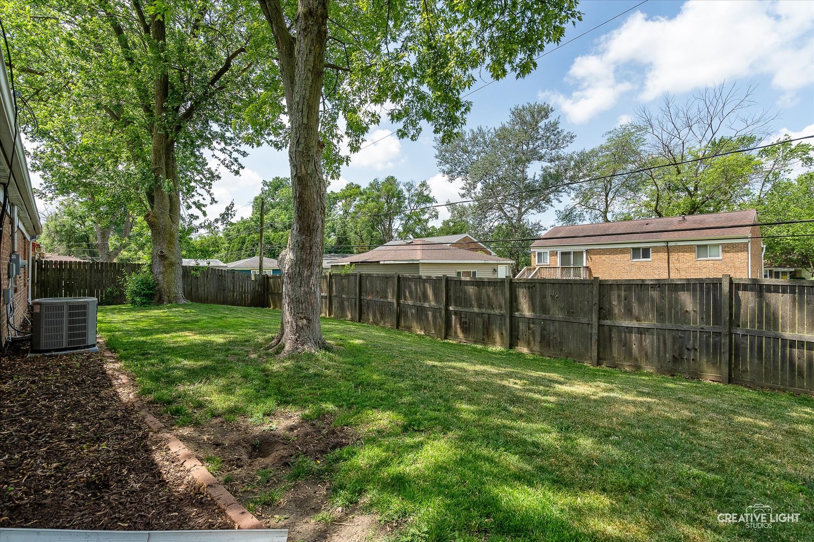 125 South Pinecrest Road Bolingbrook, IL 60440 - Photo 19 of 22 a backyard of a house with lots of green space