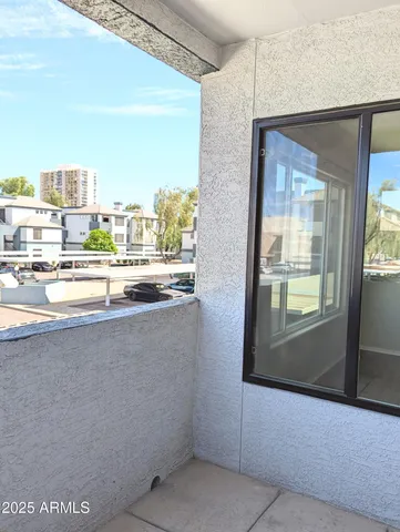 a kitchen with kitchen island and windows