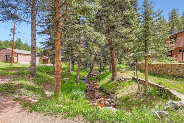 a backyard of a house with lots of green space