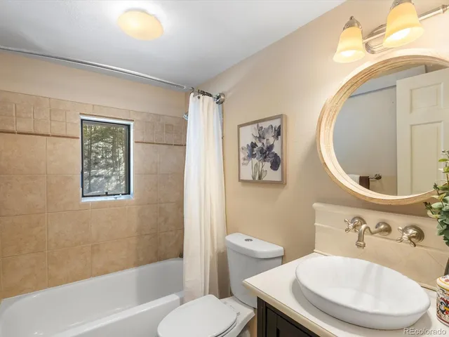 a view of a livingroom with workspace and a couch