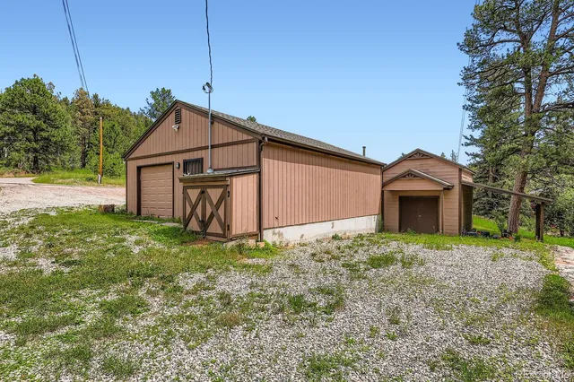 a view of a balcony with wooden fence and floor