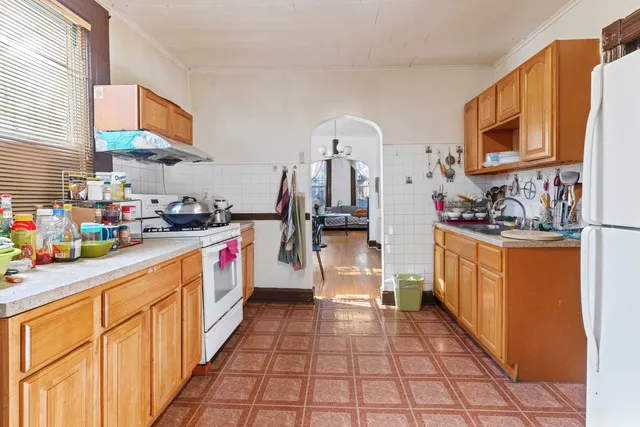 a kitchen with stainless steel appliances a sink and cabinets