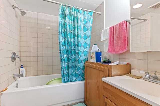 a bathroom with a sink and a bathtub