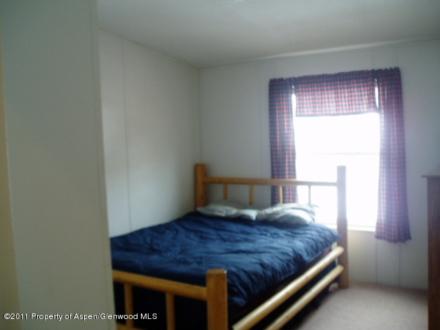 659 Park Avenue Rifle, CO 81650 - Photo 12 of 15 a room with a bed and a window