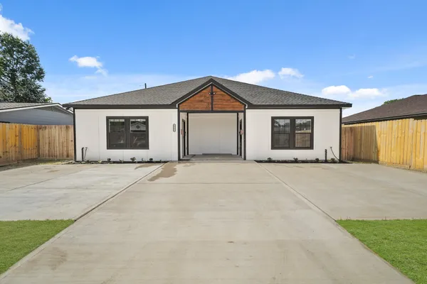 a front view of a house with a garage