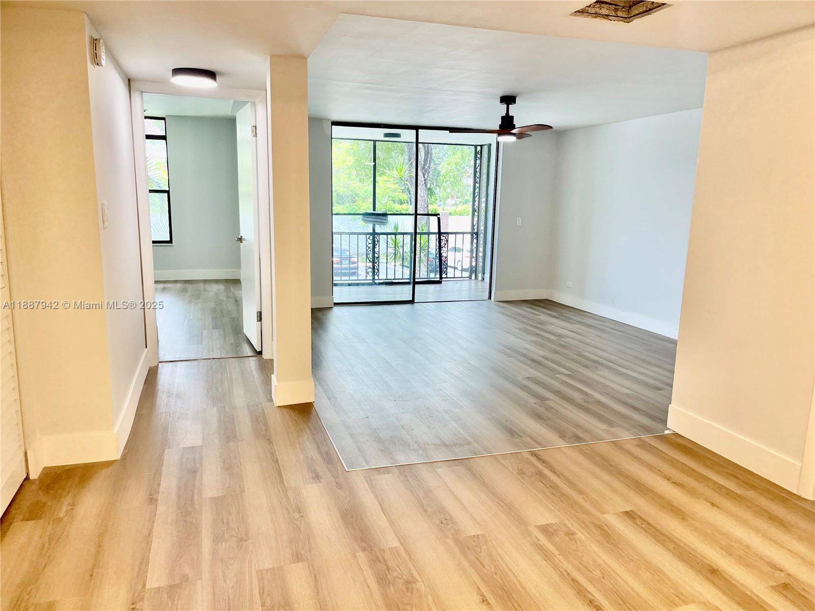 3680 Inverrary Drive, Unit 2B Lauderhill, FL 33319 - Photo 4 of 12 a view of empty room with wooden floor and fan