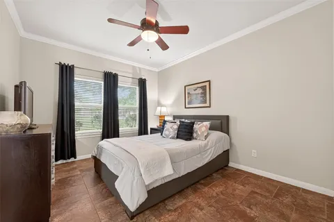 a bedroom with a large bed and a large window