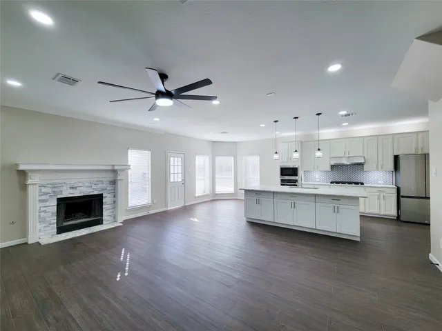 a bathroom with a tub sink toilet and a mirror