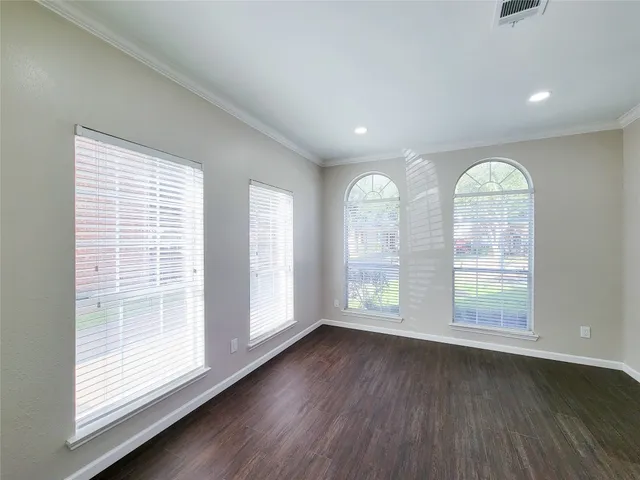 a bathroom with a granite countertop sink a mirror a bathtub and shower