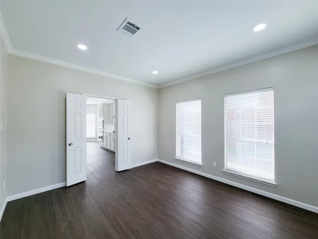 a front view of a house with a small yard